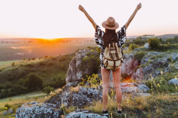 rear-view-female-hiker-with-arm-raised_23-2147842610-min.jpg