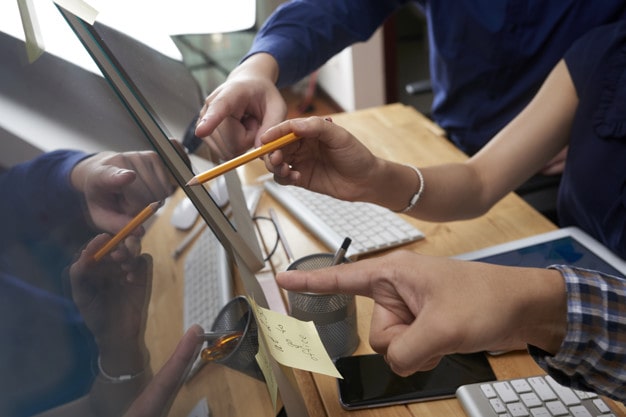 business people pointing screen 1098 21556 min